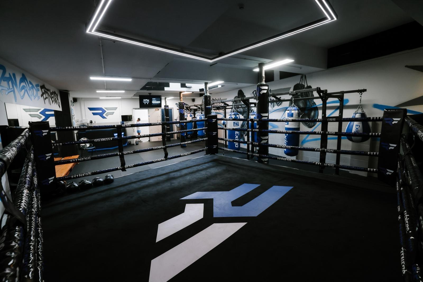 Boxing ring corner and heavy bag rig at Ringside Fitness